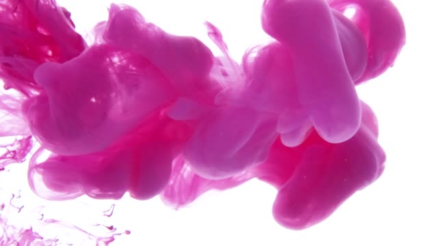 Pink-ink-dropped-in-water-on-white-background