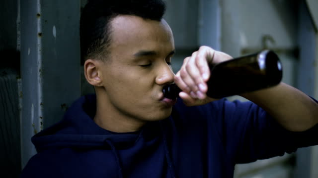 Guy-drinking-beer-trying-to-calm-down-inner-pain-and-depression,-teenage-years