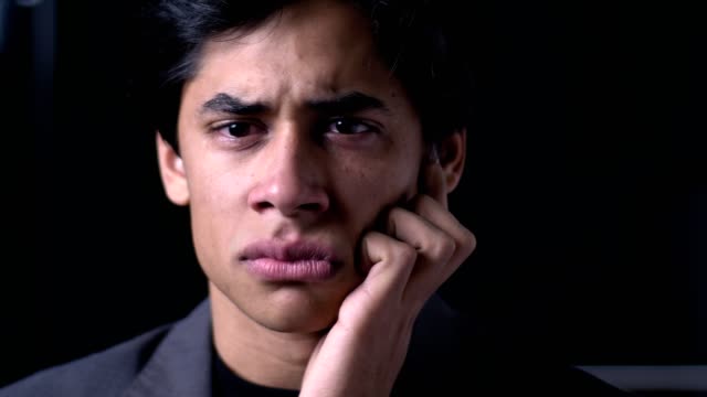 close-up-portrait-of-Depression,-sadness.-Upset-Young-man-crying