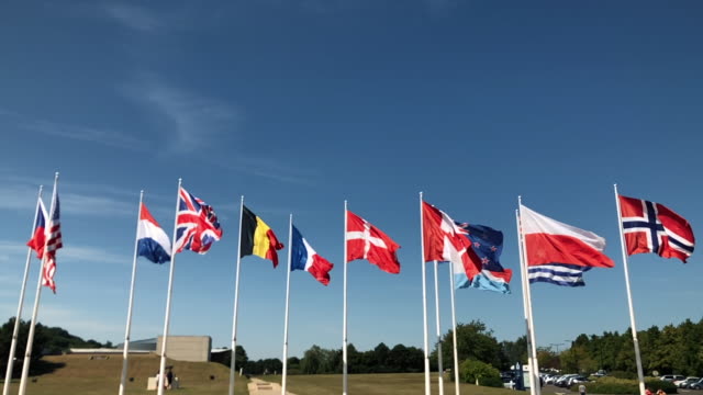 Flags-flying-united-in-WW2-memorial-in-Caen,-France