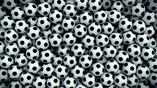 Soccer-balls-falling,-filling-the-picture,-transition-with-alpha