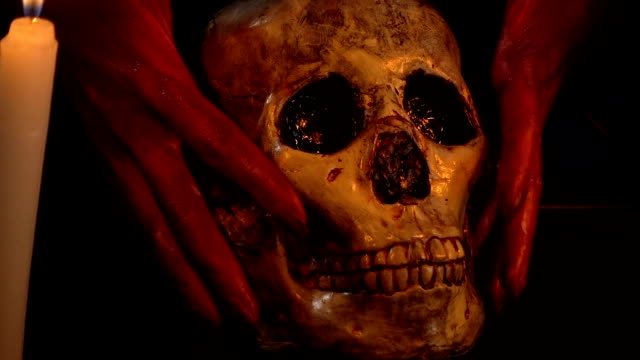 Girl-with-blood-hands-holding-skull