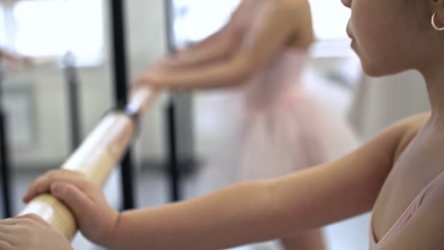 Girls-Exercising-at-Ballet-Barres