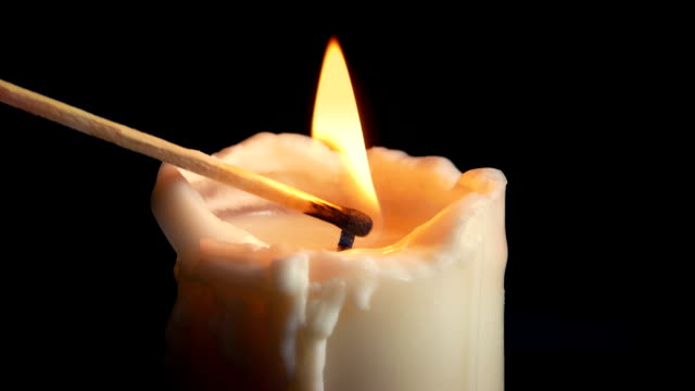 Large-Candle-Lit-With-Match