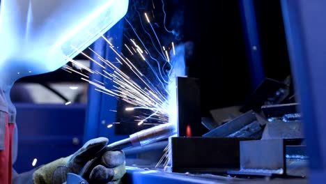 Welding-sparks-at-metal-production-plant-slow-motion