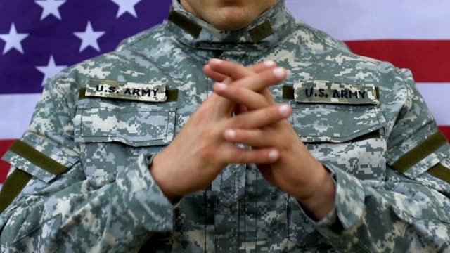 Military-man-praying-US-flag-background,-moment-of-silence,-respect-for-heroes