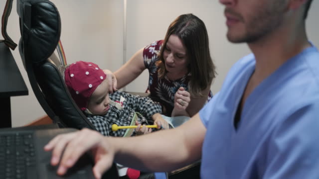 Doctor-During-Electroencephalography-Eeg-Exam-With-Sick-Child-In-Hospital