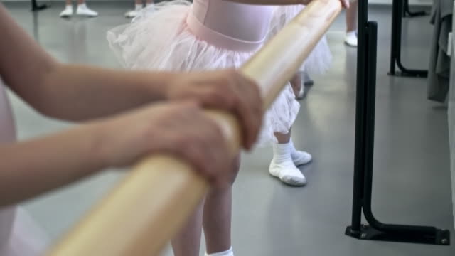 Little-Dancers-Exercising-at-Ballet-Barre