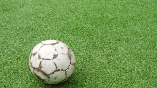 A-soccer-ball-on-an-artificial-football-lawn
