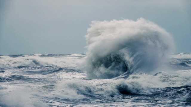 High-wave-breaking-on-the-rocks-of-the-coastline.-Extremely-Big-Wave-crushing-coast-,-Large-Ocean-Beautiful-Wave.-Super-Slow-Motion.