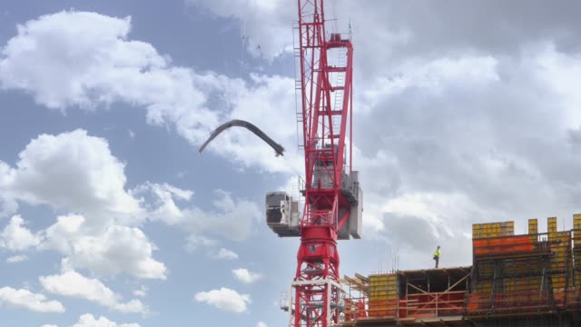 Large-Construction-Crane-Lifts-Rebar-on-Construction-Site