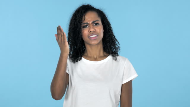 African-Girl-with-Frustration-and-Anger-Isolated-on-Blue-Background