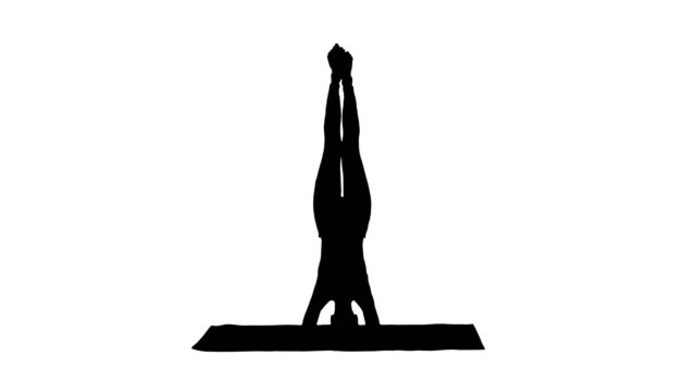 Silhouette-Woman-performing-a-headstand-with-split