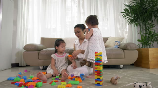 Woman-Playing-with-Kids