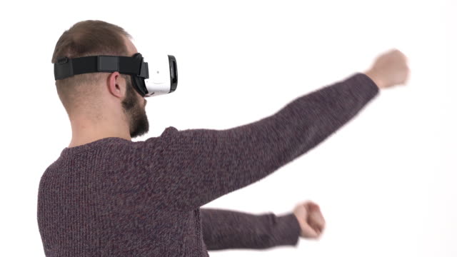 Man-imitates-driving-car-in-virtual-reality-glasses.-3d-cyberspace-simulation-concept