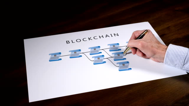 Senior-technologist-pointing-to-blockchain-illustration