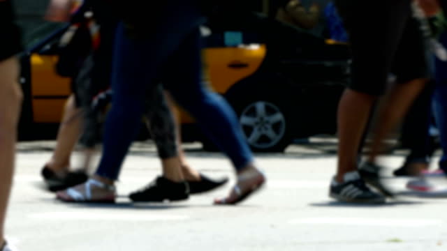 Side-view-blurry-pedestrians-walking.Time-Lapse.
