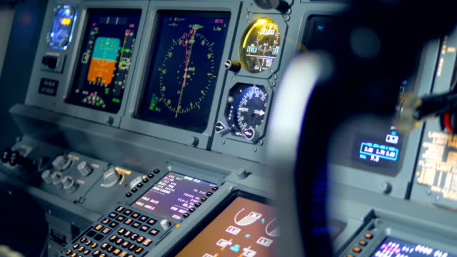 Monitors-on-a-plane's-dashboard,-close-up.