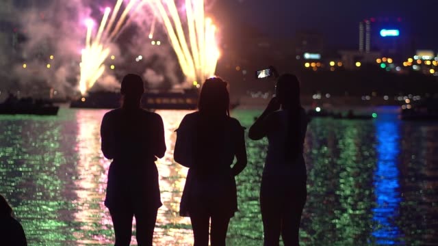 A-group-of-people-are-happy-during-the-fireworks.-slow-motion