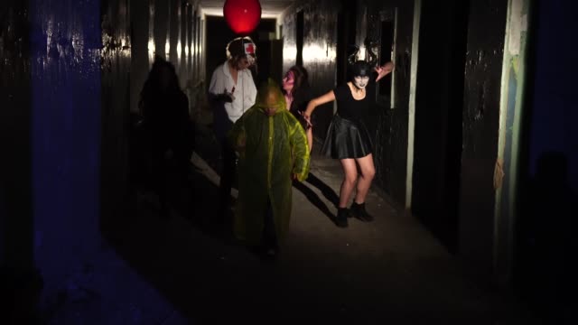 Zombies-and-scary-demons-walking-down-the-dark-corridor