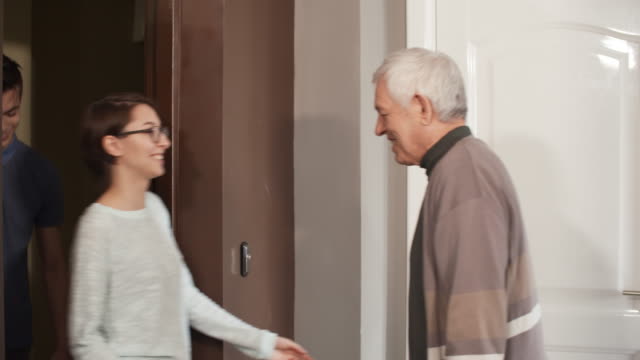 Two-Caregivers-Visiting-Elderly-Man