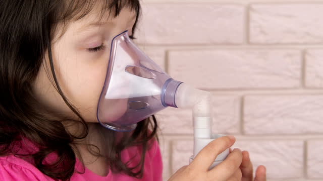 Asthma.-The-child-inhales-the-nebulizer-mask.