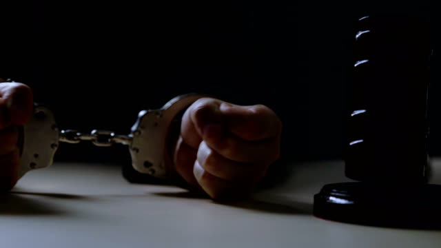 Closeup-of-handcuffed-judge-hands,-injustice,-corruption,-bribery,-crime