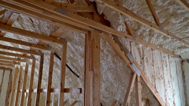 Closeup-on-termal-insulation-installing-at-the-attic-insulation-of-the-house