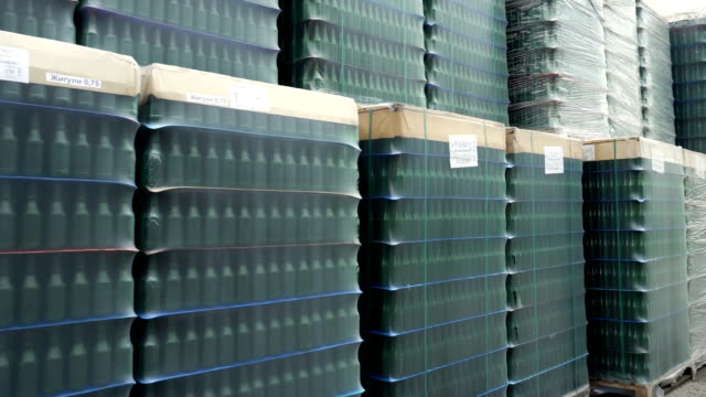 A-lot-of-wrapped-empty-beer-bottles-on-pallets