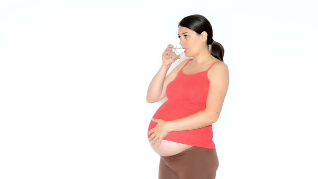 Pregnant-Woman-Taking-a-Pill