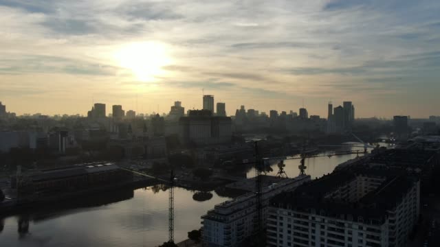 Buenos-Aires-Puerto-Madero-sky-scrappers-and-park-on-sunset-aerial