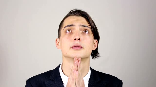 Young-man-praying,-asking-God-for-help.