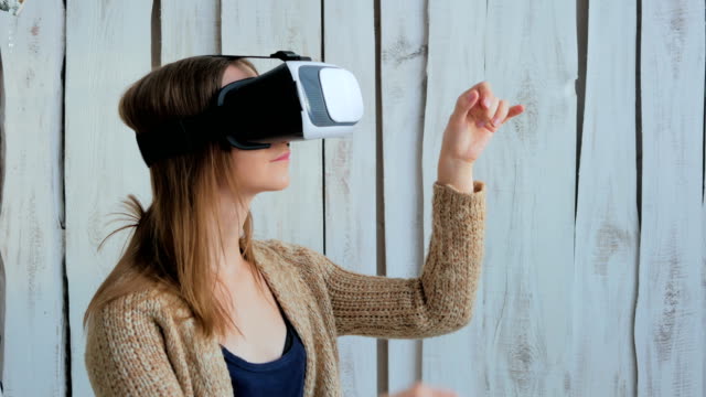 Young-woman-using-Virtual-Reality-Glasses