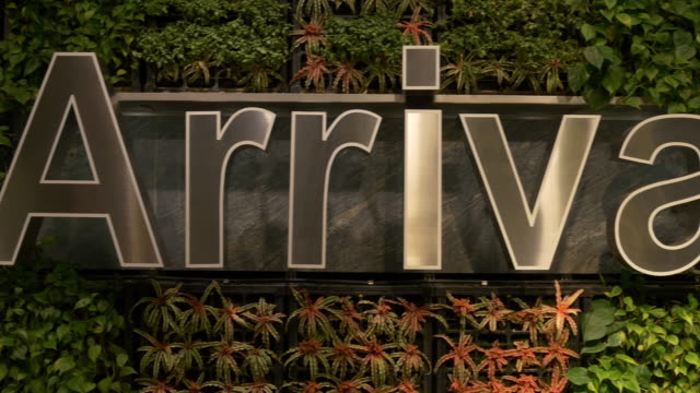 singapore-famous-changi-airport-arrival-sign-wall-panorama-4k-footage