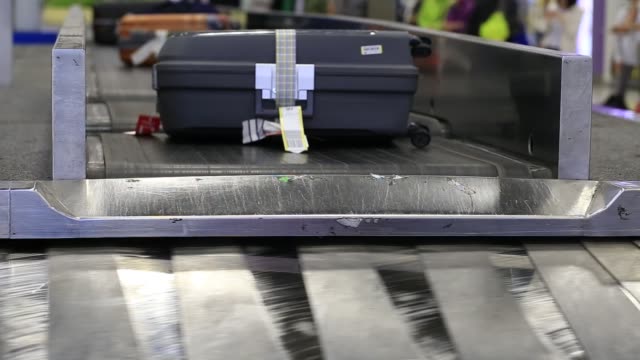 Baggage-conveyor-belt-in--Airport-carrying-the-passenger-luggage.-Thailand