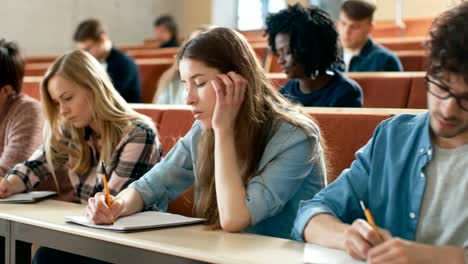 Group-of-Multi-Ethnic-Students-in-Classroom-Taking-Exam/-Test.-Bright-Young-People-Study-at-University.