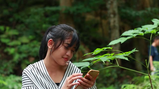 Asian-Young-Students-or-Start-up-Adolescents-using-smartphone-E-learning-homework,-watching-exam-results-in-phone-happy-joy-of-accomplishing-successful-goal-in-expression-positive-emotion-on-campus
