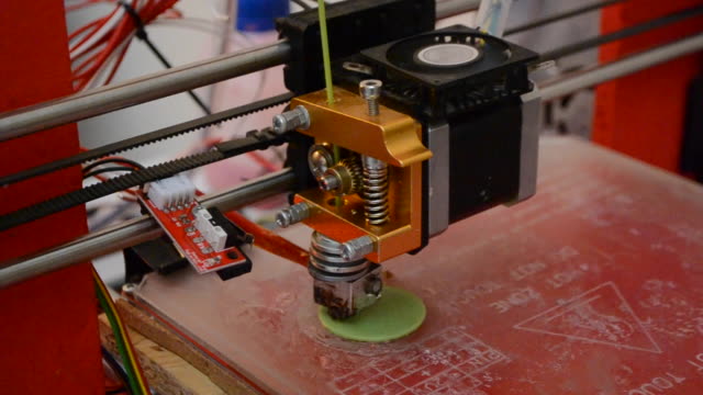 3D-printer-working.-Fused-deposition-modeling,-FDM.-3D-printer-printing