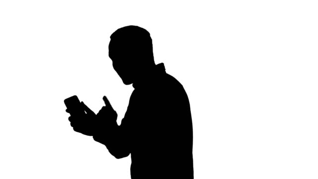 Silhouette-Portrait-of-successful-handsome-young-man-video-chating