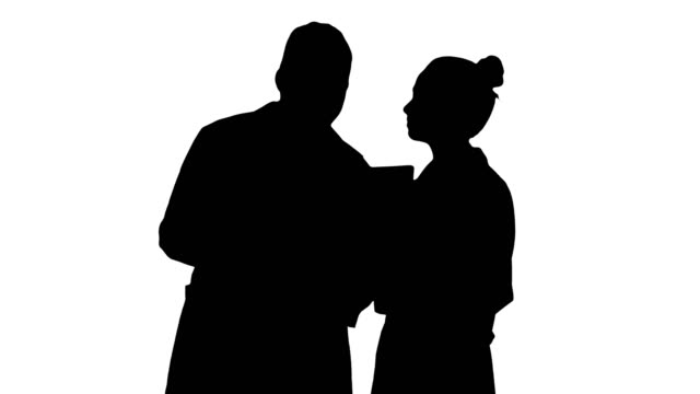 Silhouette-Serious-nice-woman-doctor-and-afro-american-doctor-study-brain-x-ray