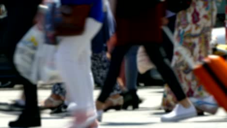 Side-view-blurry-pedestrians-walking.