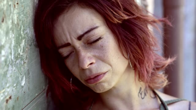 Sad-Desperate-young-Woman-Crying-outdoor