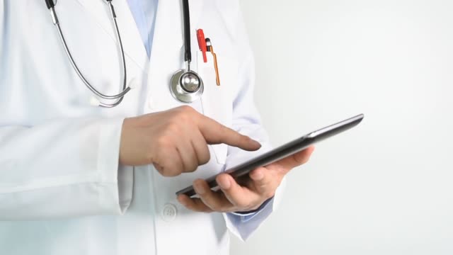 Doctor-Using-Tablet-for-Browsing-Information-in-Hospital