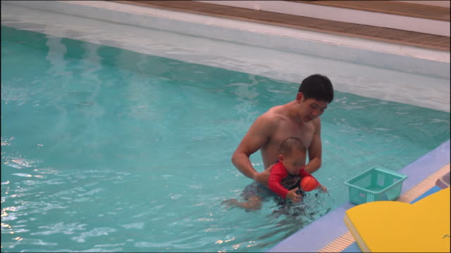 Father-and-Son-in-Swimming-Pool