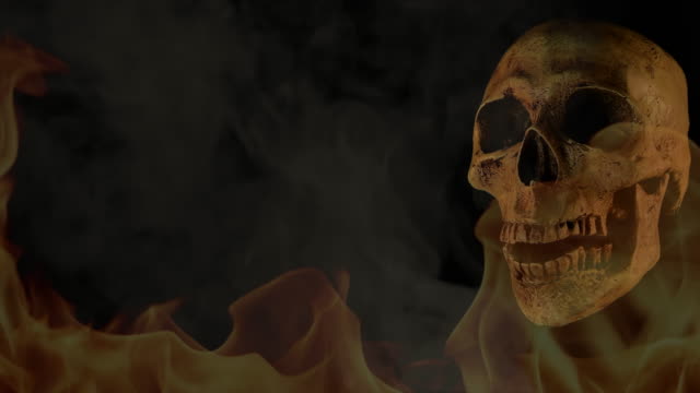 Human-skull-in-fire-and-smoke-on-black-background.