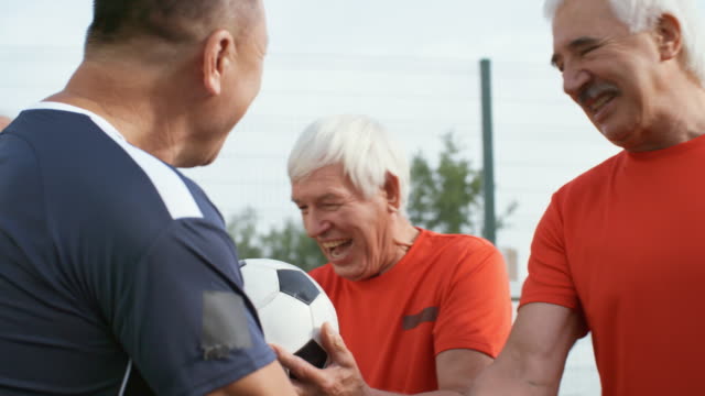 Elderly-Football-Players-Shaking-Hands