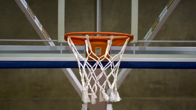 People-training-basketball-free-throw-and-not-hitting.-Basketball-net-close-up.-Flat-plane.-Front-view