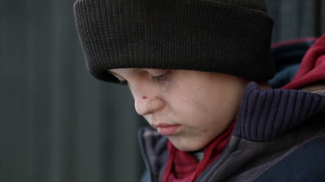 dramatic-portrait-of-a-little-homeless-boy