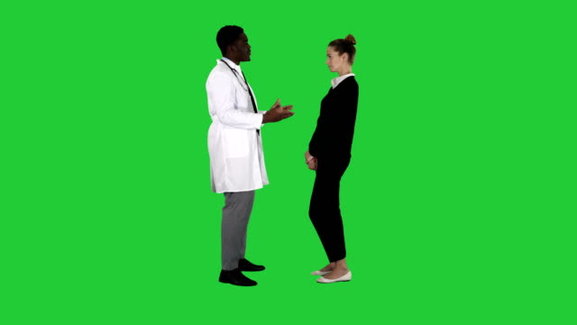 Doctor-telling-good-news-to-a-patient-on-a-Green-Screen,-Chroma-Key