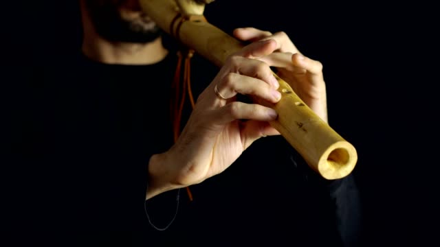 man-playing-the-flute